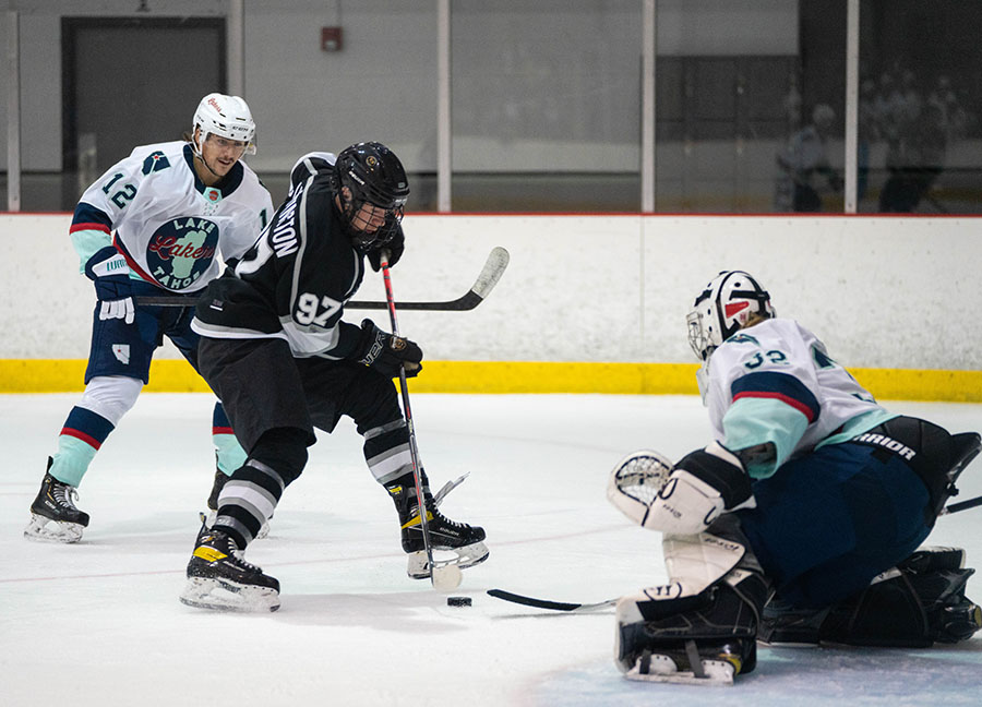 John Hughes poke check, courtesy Mike Zitek Photos