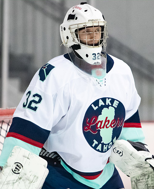 John Hughes profile, wearing goalie mask, courtesy Mike Zitek Photos